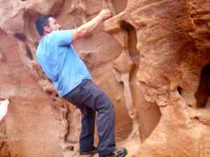 KC bouldering behind the Navajo Arch