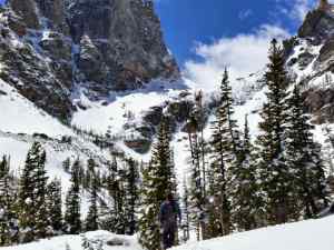 KC on the trail with the path to the Tyndall Glacier behind him