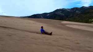 KC Sand Sledding down a dune