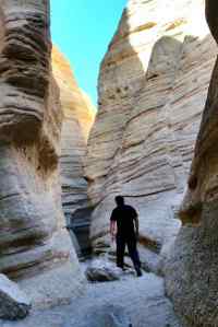 KC hiking in the canyon with the unique rock