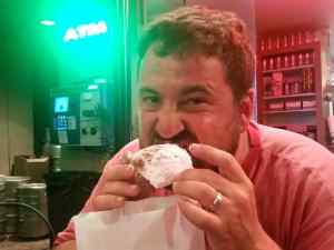 KC trying a beignet