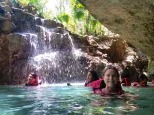 At the opening of the cave, there is another waterfall... and a Sarah!