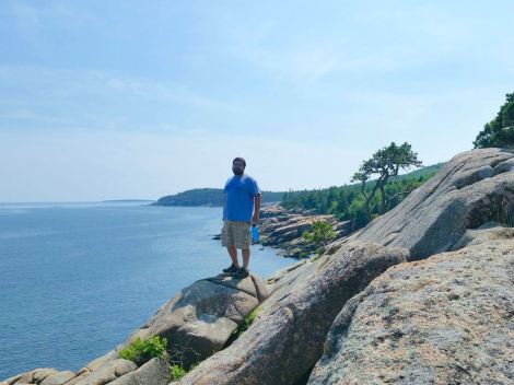 KC and the sea cliffs/rocks of Acadia National Park