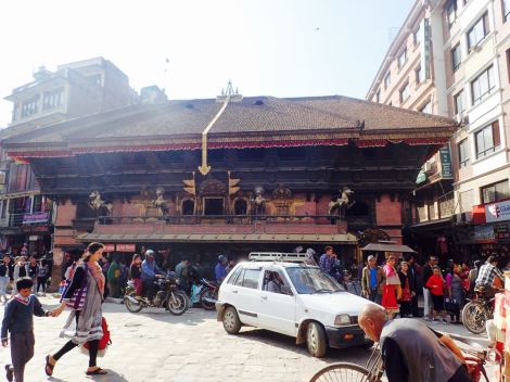 The white car is what the taxis look like in Kathmandu. This is one of the busiest intersections.